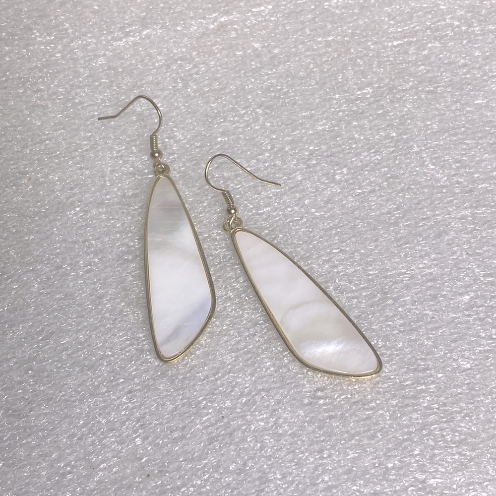 White pear like gold earrings with unique shape